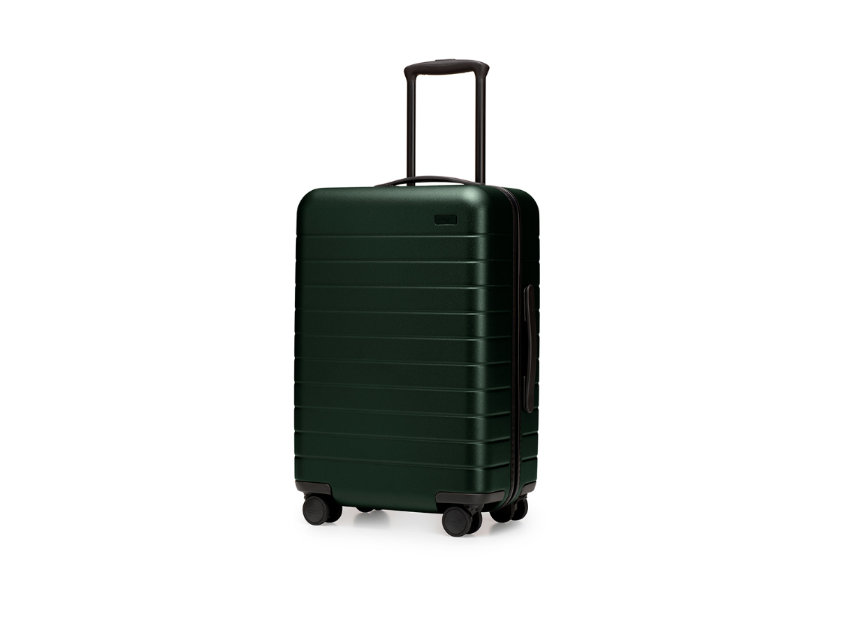 Away suitcase, the bigger carry-on in green