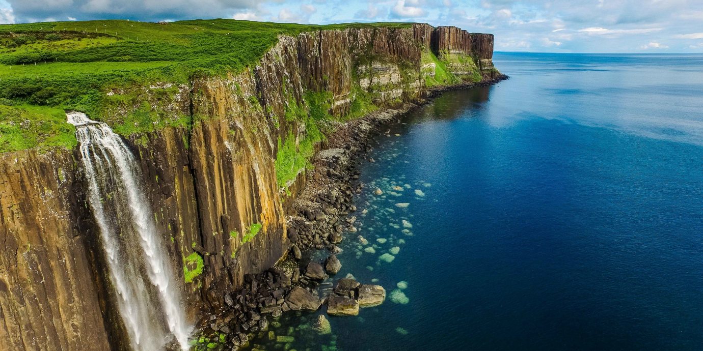 Trip Ideas Nature water outdoor cliff Coast promontory Waterfall headland sky terrain water resources coastal and oceanic landforms River water feature escarpment Sea watercourse klippe bay cove cape formation Lake surrounded