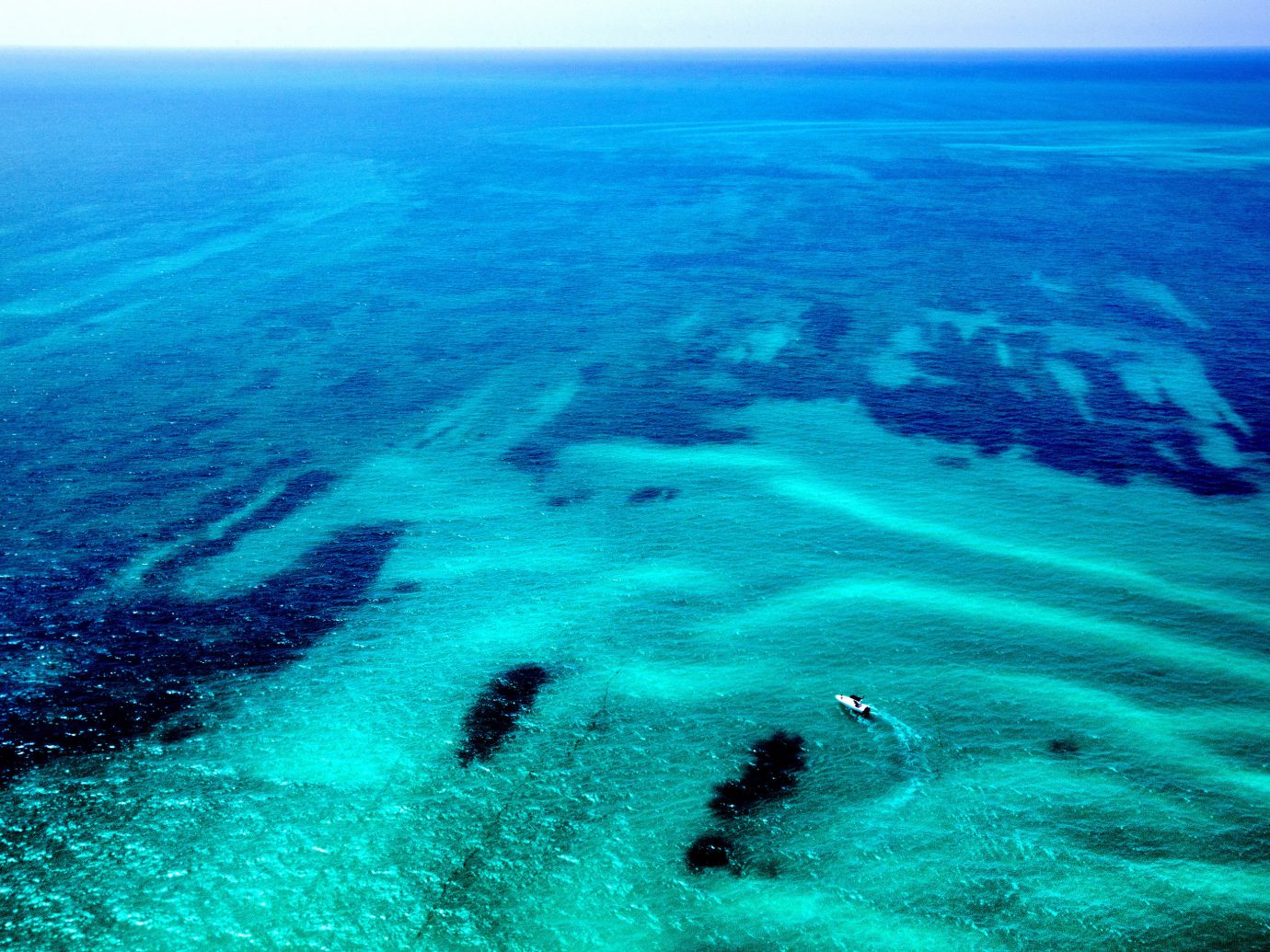 Beach water outdoor geographical feature Nature landform marine biology reef Sea Ocean wind wave wave Coast cape coral reef Island blue ocean floor