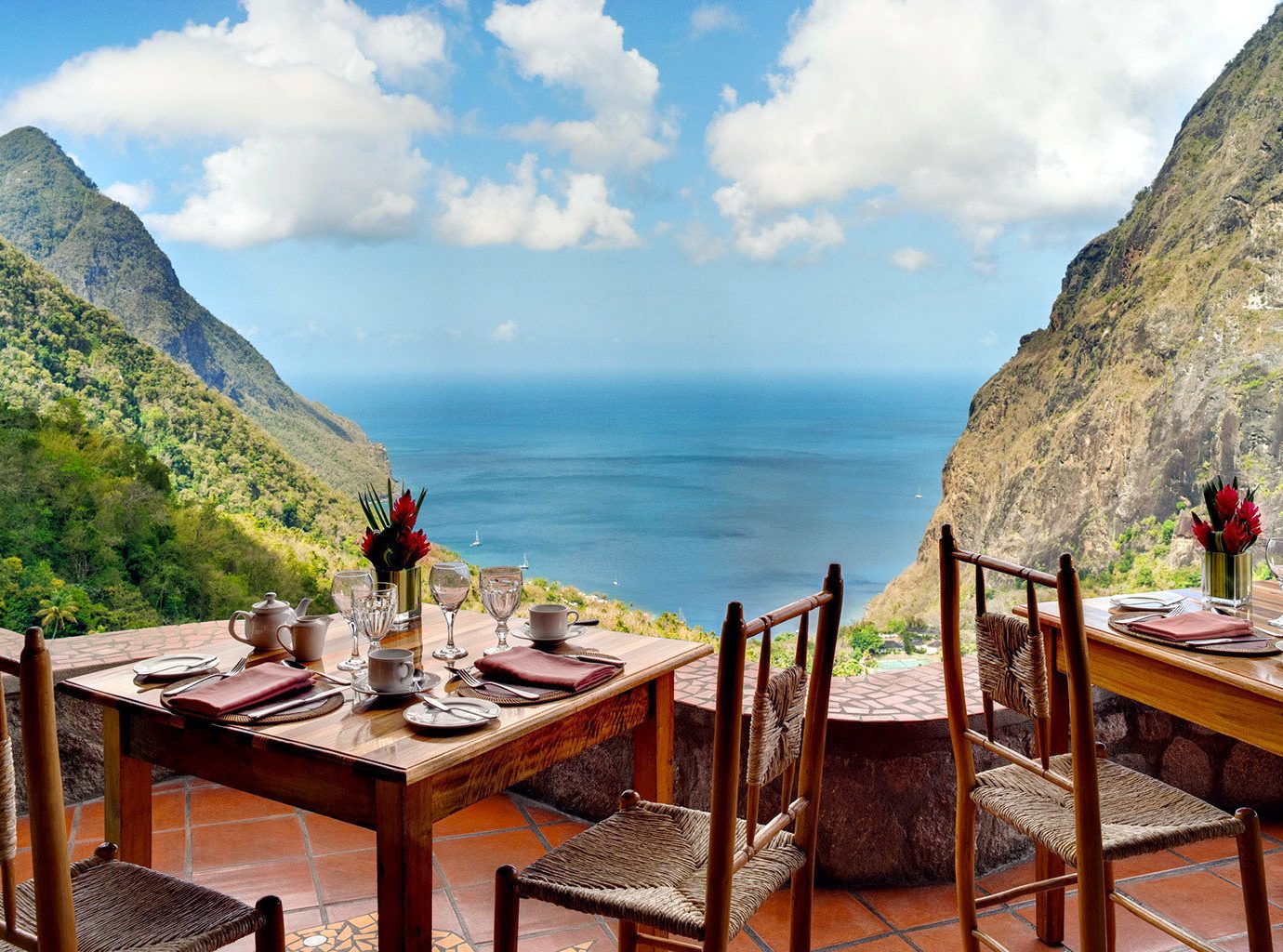 Adult-only Dining Drink Eat Food + Drink Honeymoon Hotels Luxury Luxury Travel Resort Romance Scenic views Trip Ideas mountain sky outdoor table chair leisure Nature vacation tourism Sea estate Coast travel bay overlooking set Island