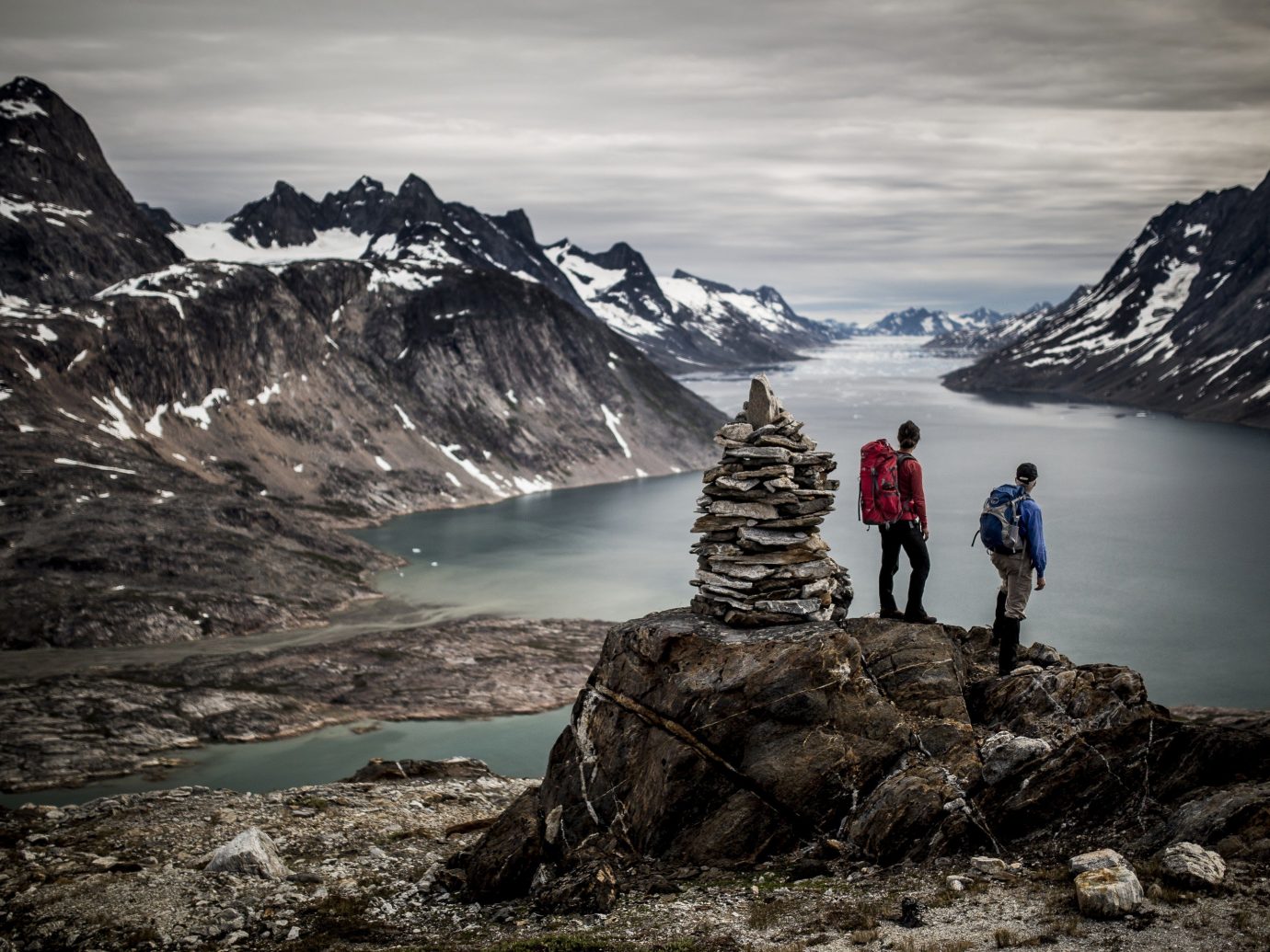 Hikers overlook the sound near Tiniteqilaaq in East Greenland