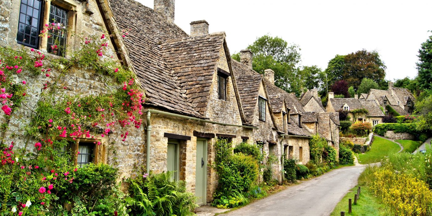 Trip Ideas cottage Village house Town home flower estate rural area almshouse tree sky real estate facade medieval architecture plant grass manor house farmhouse