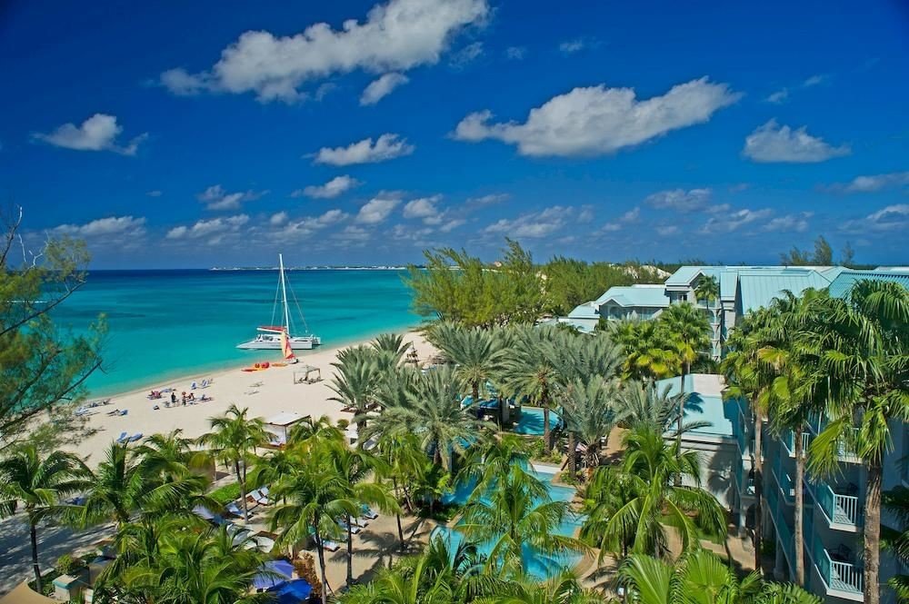 Hotels sky caribbean outdoor ecosystem Resort vacation Beach Nature Sea Coast bay tourism tropics Lagoon Ocean Island blue arecales estate plant shore