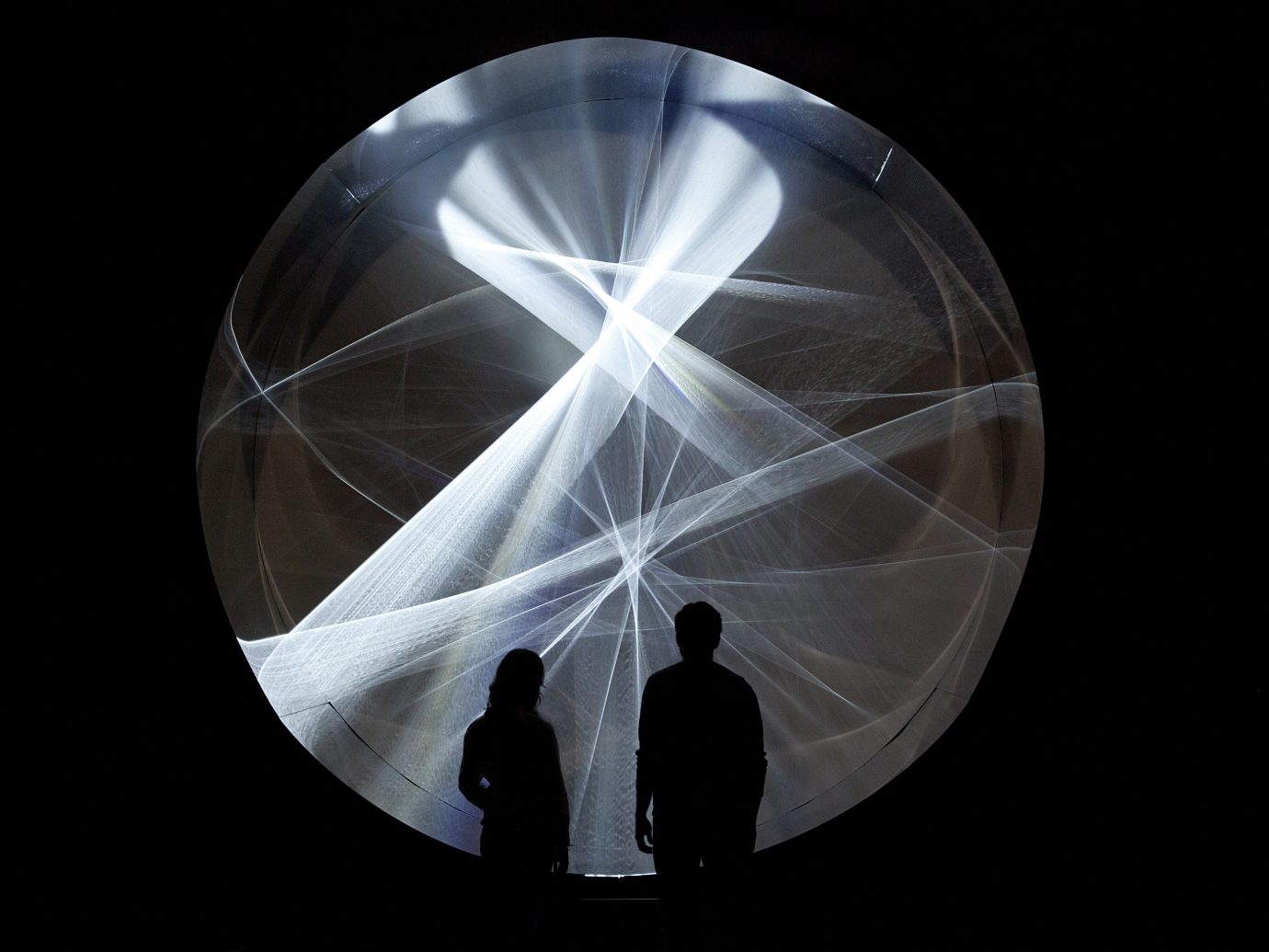 Arts + Culture light circle sandglass organ sphere shape reflection symmetry dark