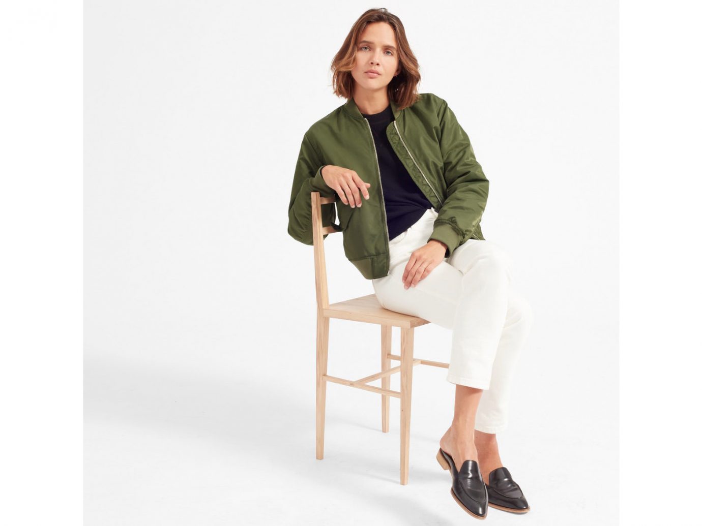 Packing Tips Spring Travel Style + Design Travel Shop person sitting standing shoulder furniture outerwear product design jacket sleeve neck coat posing