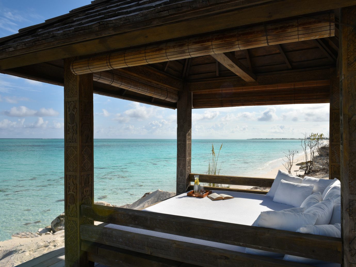 Beach front seating at COMO Parrot Cay, Turks and Caicos