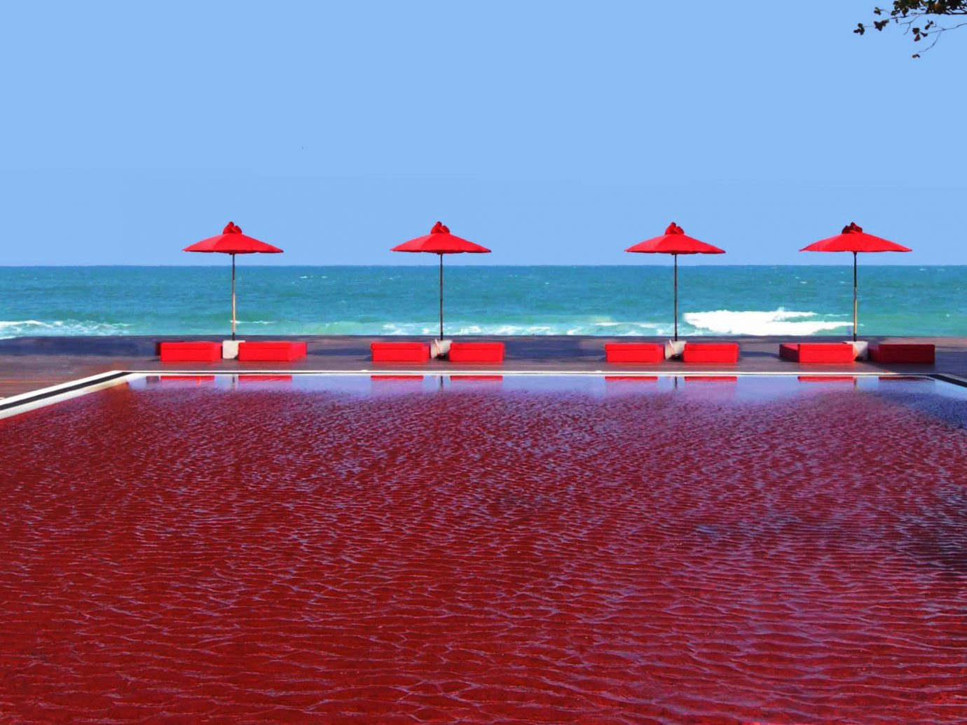 Hotels sky water outdoor red swimming pool Ocean shore horizon Sea walkway Coast bay distance