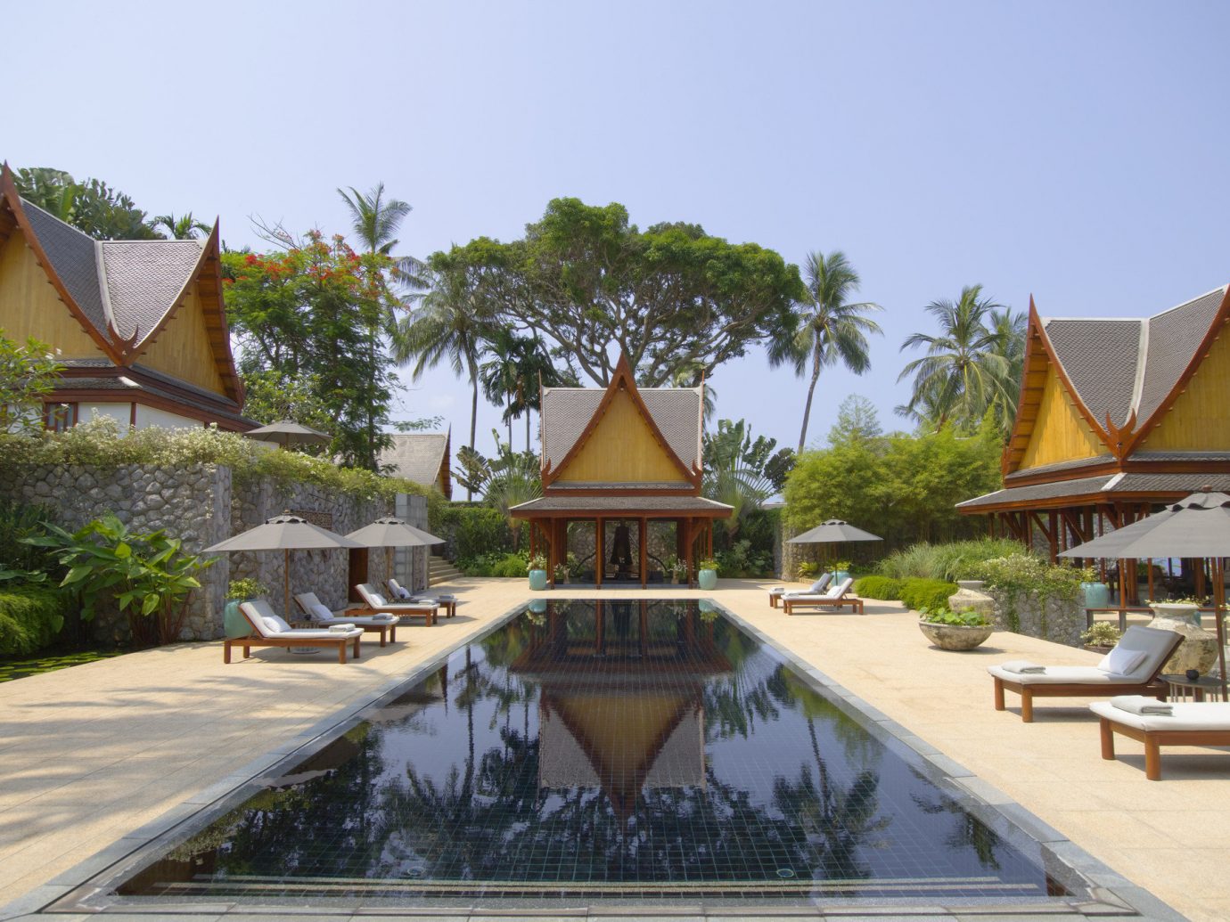 Beach Hotels Phuket Thailand tree outdoor sky property building Resort estate Villa vacation swimming pool temple wat outdoor structure palace hacienda mansion several