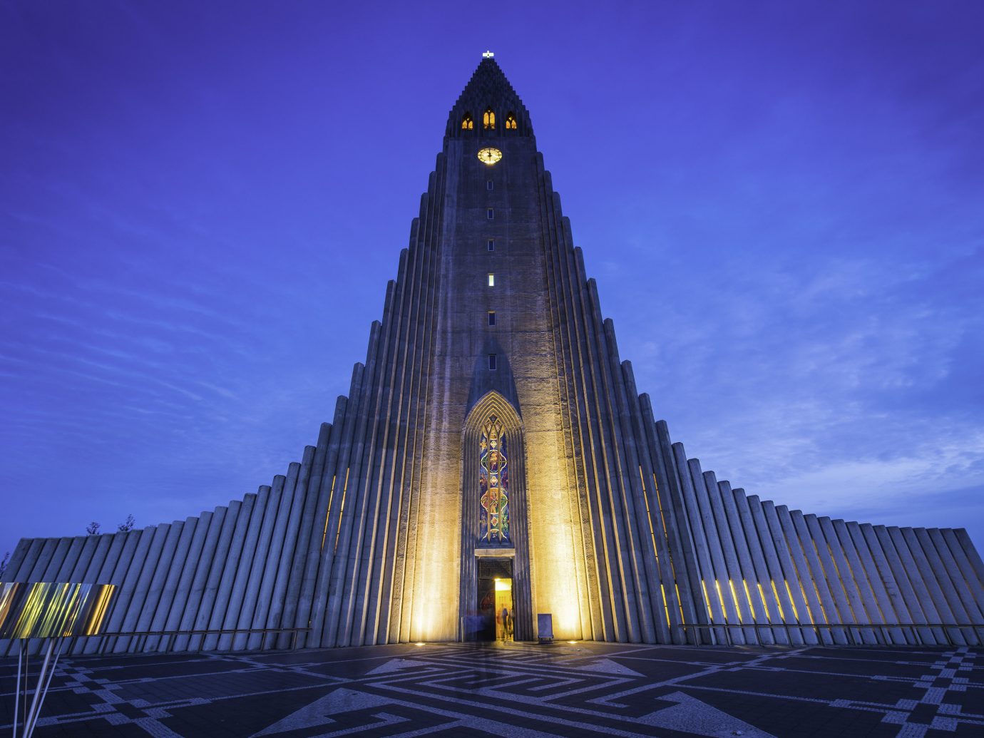 Budget Hotels Iceland Offbeat Outdoors + Adventure Road Trips Trip Ideas outdoor sky tower landmark night building spire place of worship evening cathedral monument symmetry