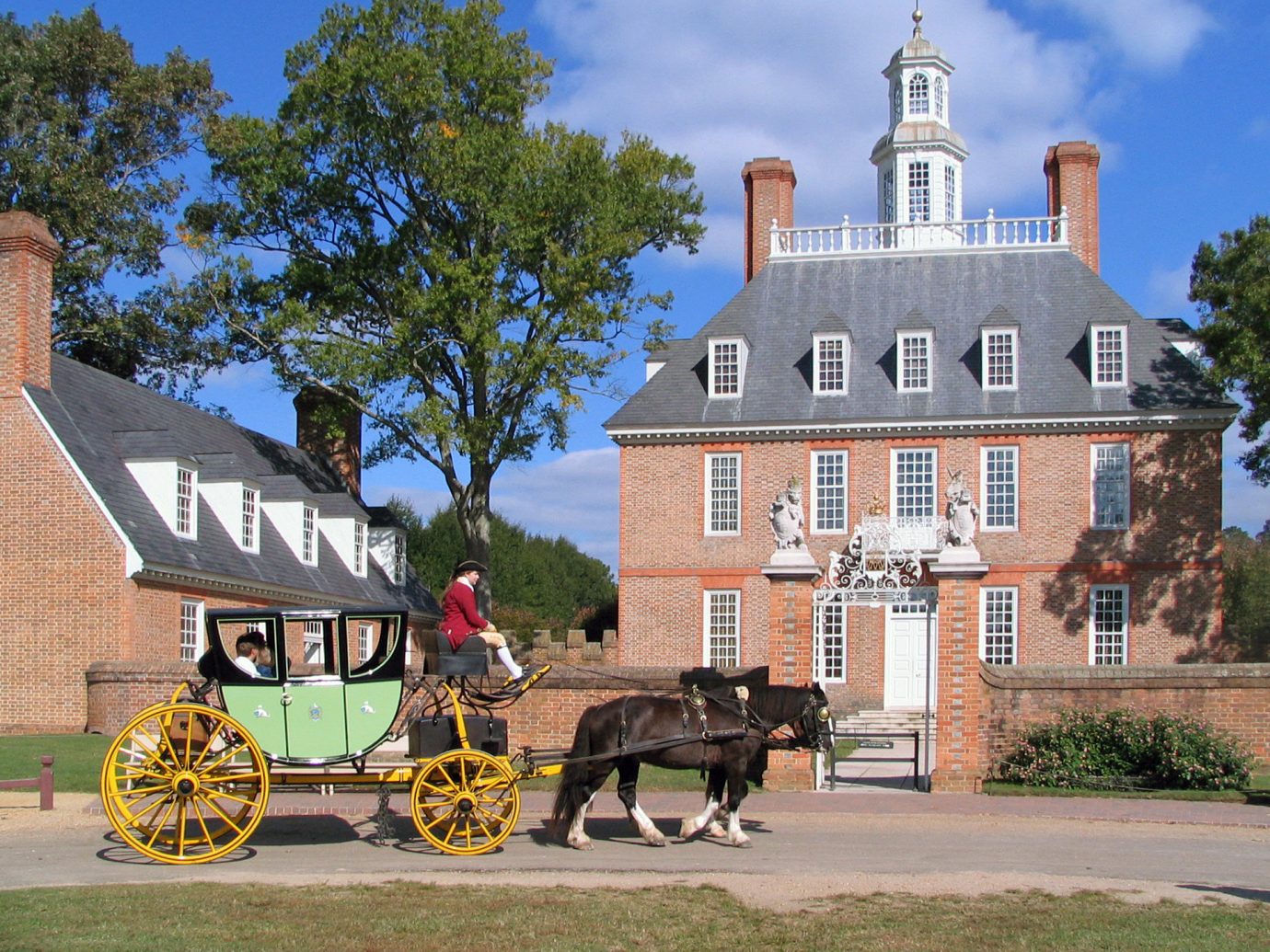 Trip Ideas outdoor tree building road carriage Town landmark street drawn house estate vacation tourism pulling home château place of worship Church horse-drawn vehicle cart