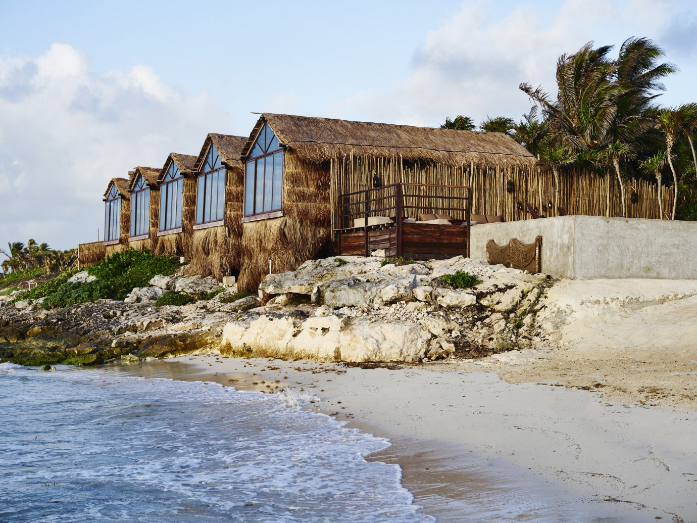 Boutique Hotels Hotels Mexico Tulum sky outdoor body of water house Coast water shore Sea wood Nature real estate cottage Ocean old shack tree rock stone