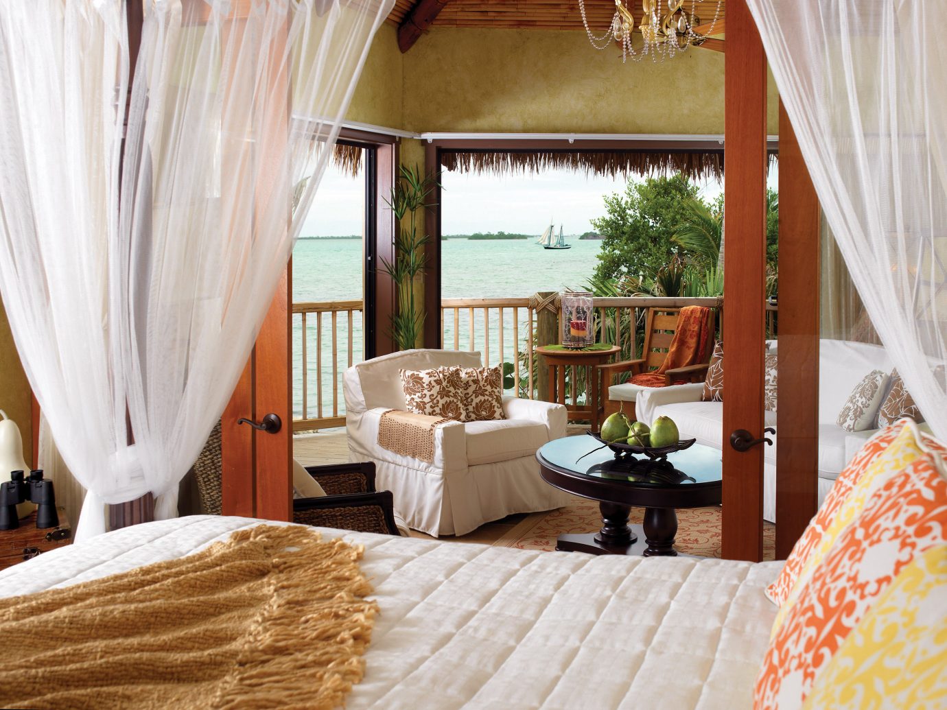Beach Beachfront Bedroom Hotels Island Resort Romance Romantic Scenic views Waterfront indoor curtain bed room property interior design cottage home Suite estate Villa living room real estate farmhouse furniture decorated