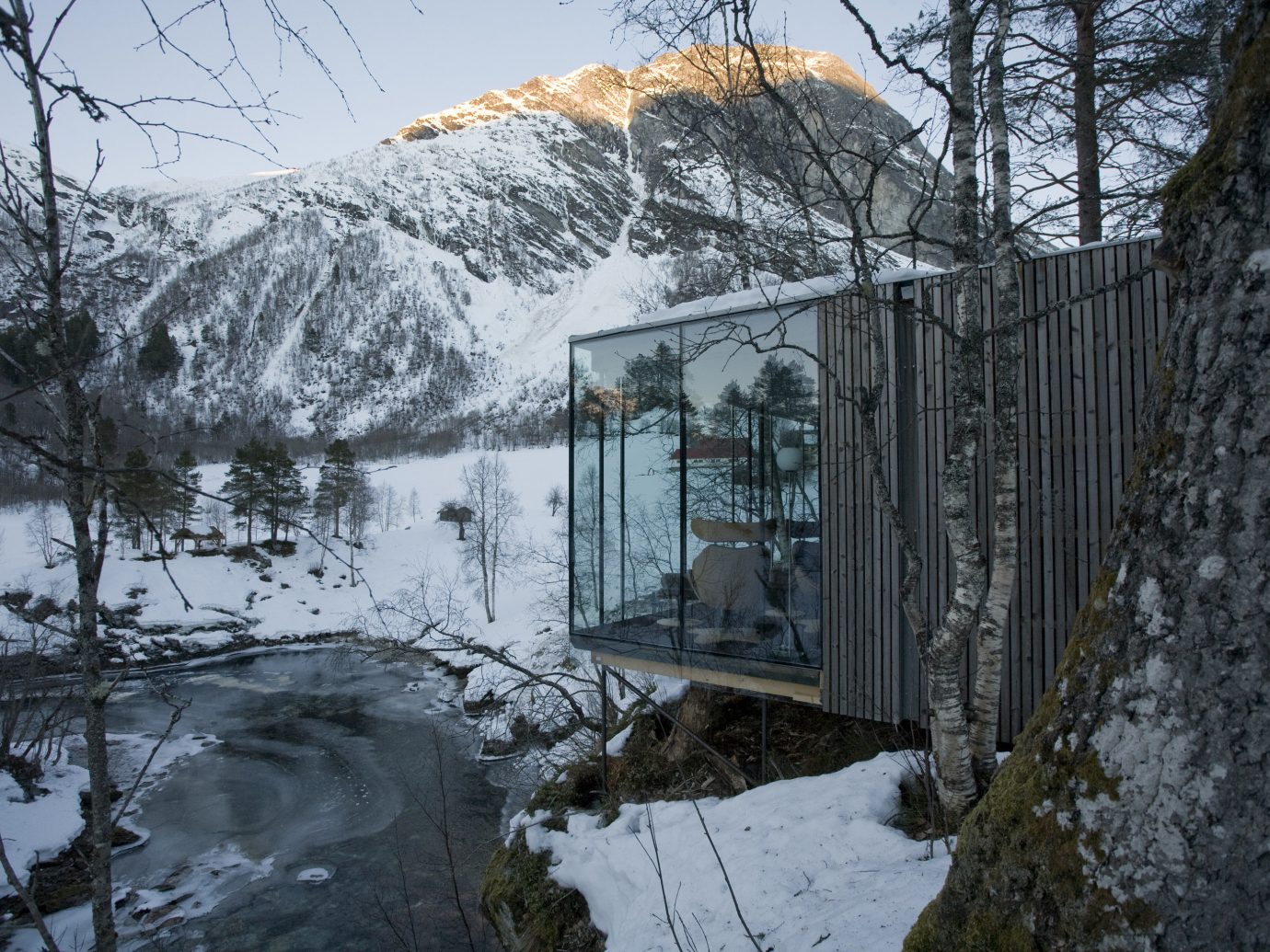 Design Hotels snow outdoor tree Winter covered reflection water freezing geological phenomenon mountain sky mountain range house ice home frost landscape cottage alps slope River plant building