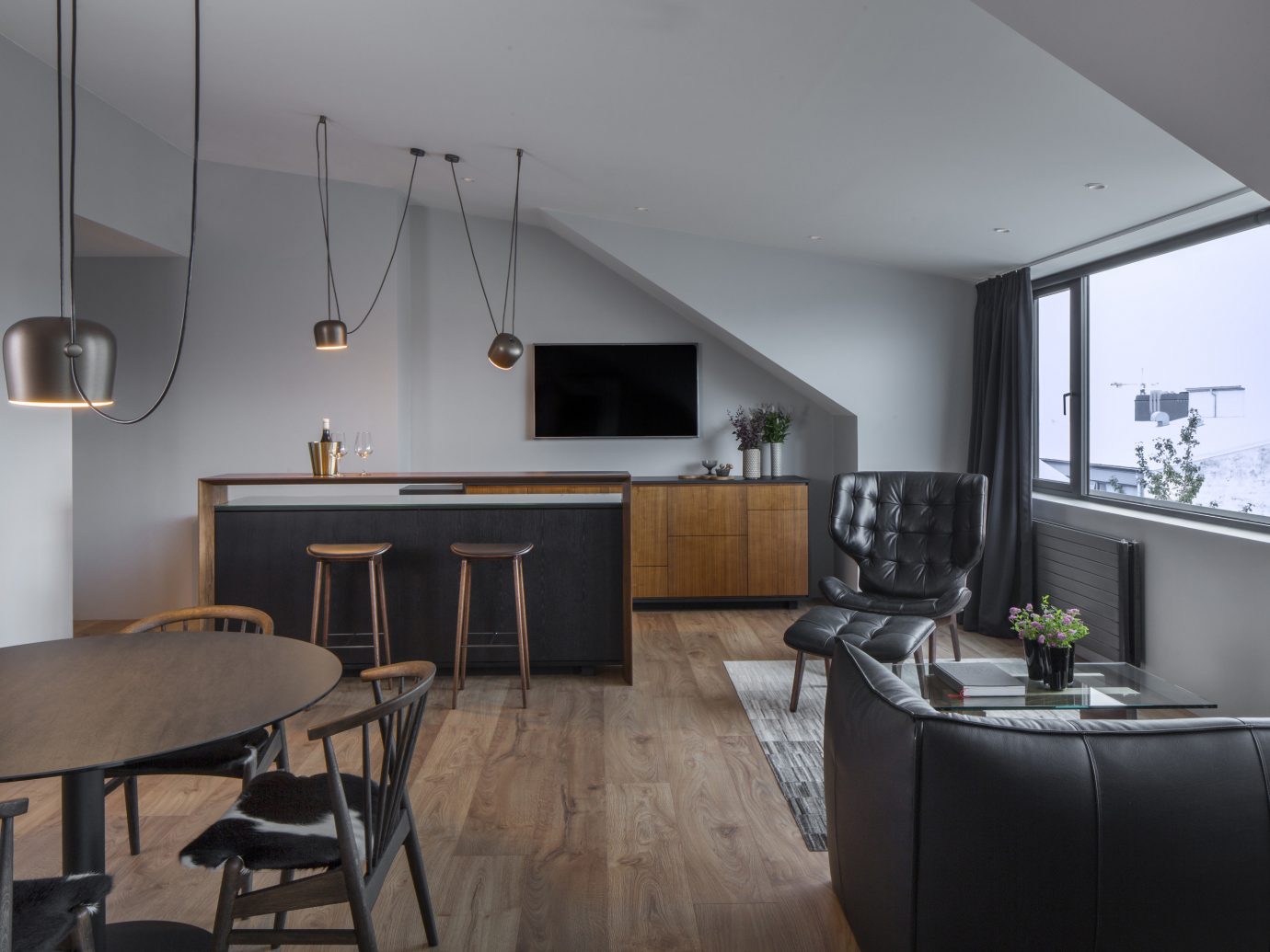 Boutique Hotels Hotels Iceland Outdoors + Adventure Reykjavík Road Trips indoor wall floor room chair interior design ceiling Architecture Living living room table loft real estate house interior designer apartment furniture area