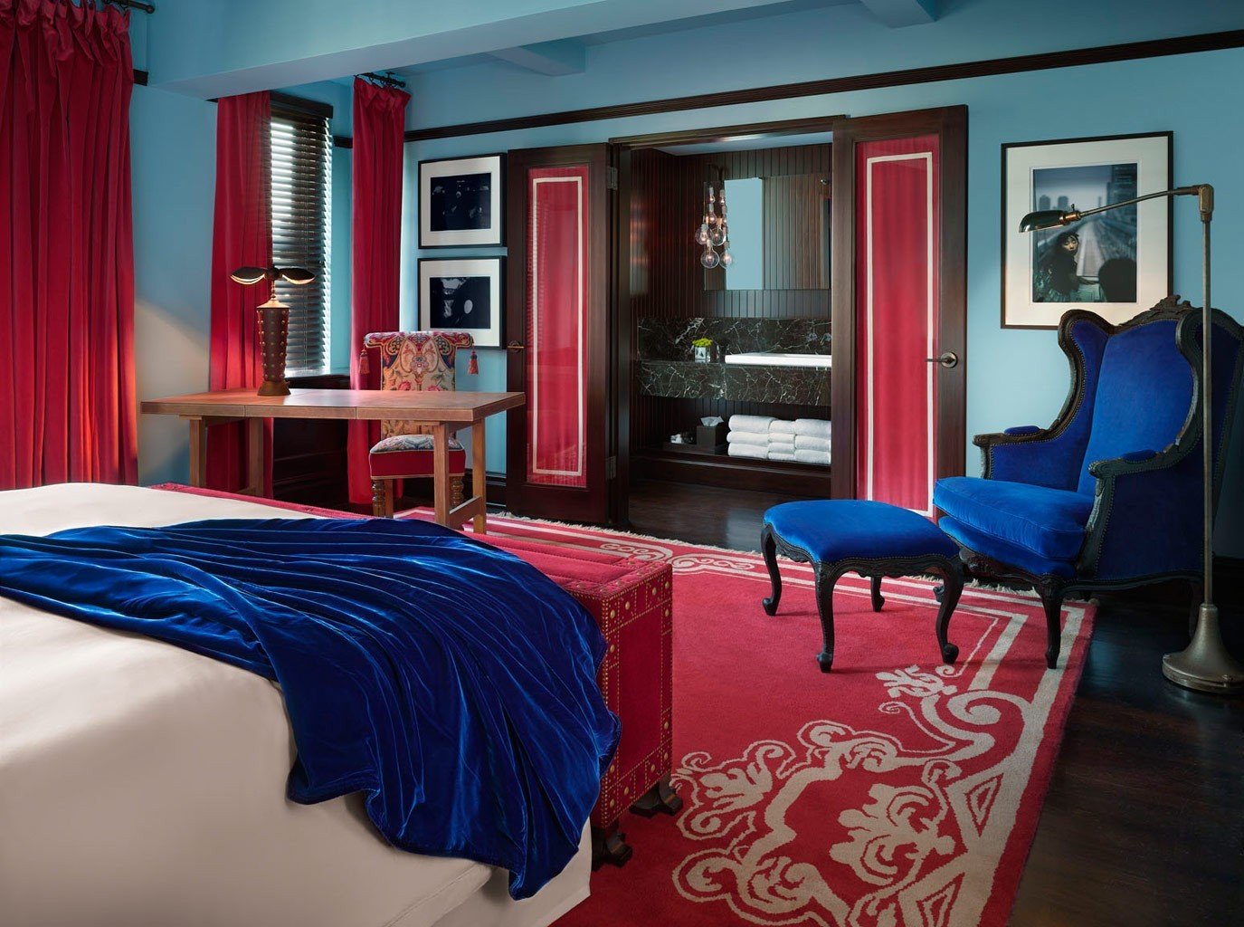 Hotels Offbeat indoor room wall floor red window bed property Living house Suite interior design furniture home living room Bedroom estate real estate cottage apartment blue decorated area bright colorful