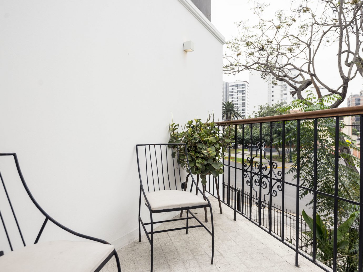 Boutique Hotels Hotels property handrail building Balcony home house real estate apartment chair tree outdoor structure stairs estate window furniture Fence plant area