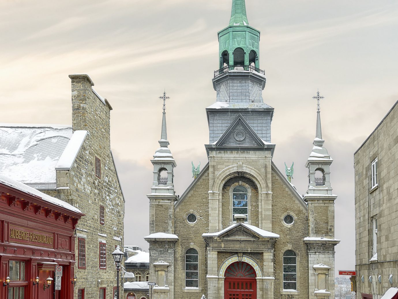 Canada Montreal Toronto Trip Ideas Weekend Getaways snow outdoor building sky Town Winter landmark Church steeple City facade freezing spire tree window place of worship chapel medieval architecture day