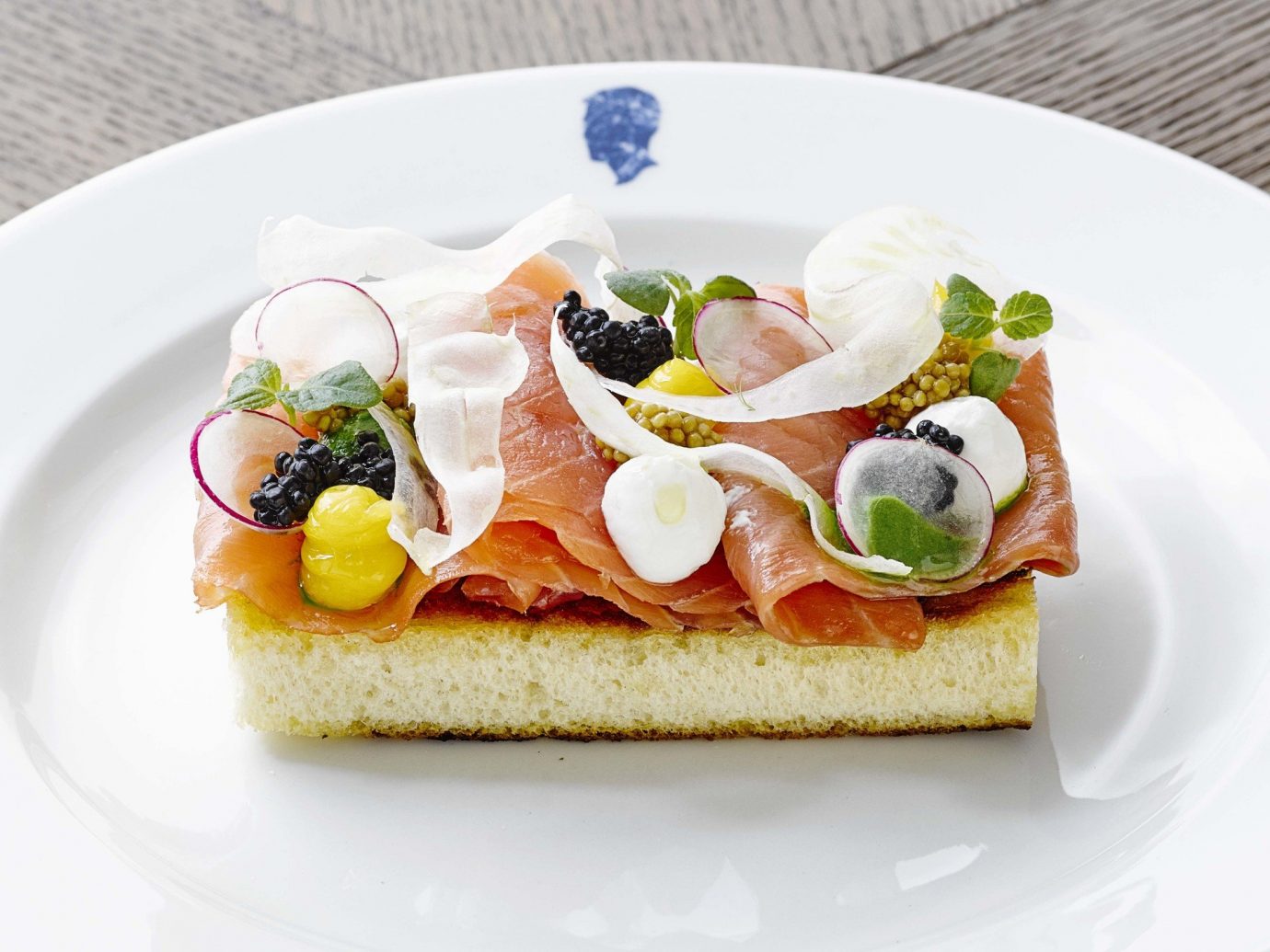 Hotels Travel Tips plate food table dish meal breakfast slice smoked salmon cuisine white canapé bruschetta produce hors d oeuvre toast prosciutto sliced dessert arranged