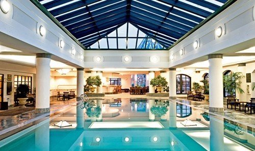 Travel Tips indoor swimming pool ceiling property leisure window Resort estate leisure centre condominium home real estate interior design mansion