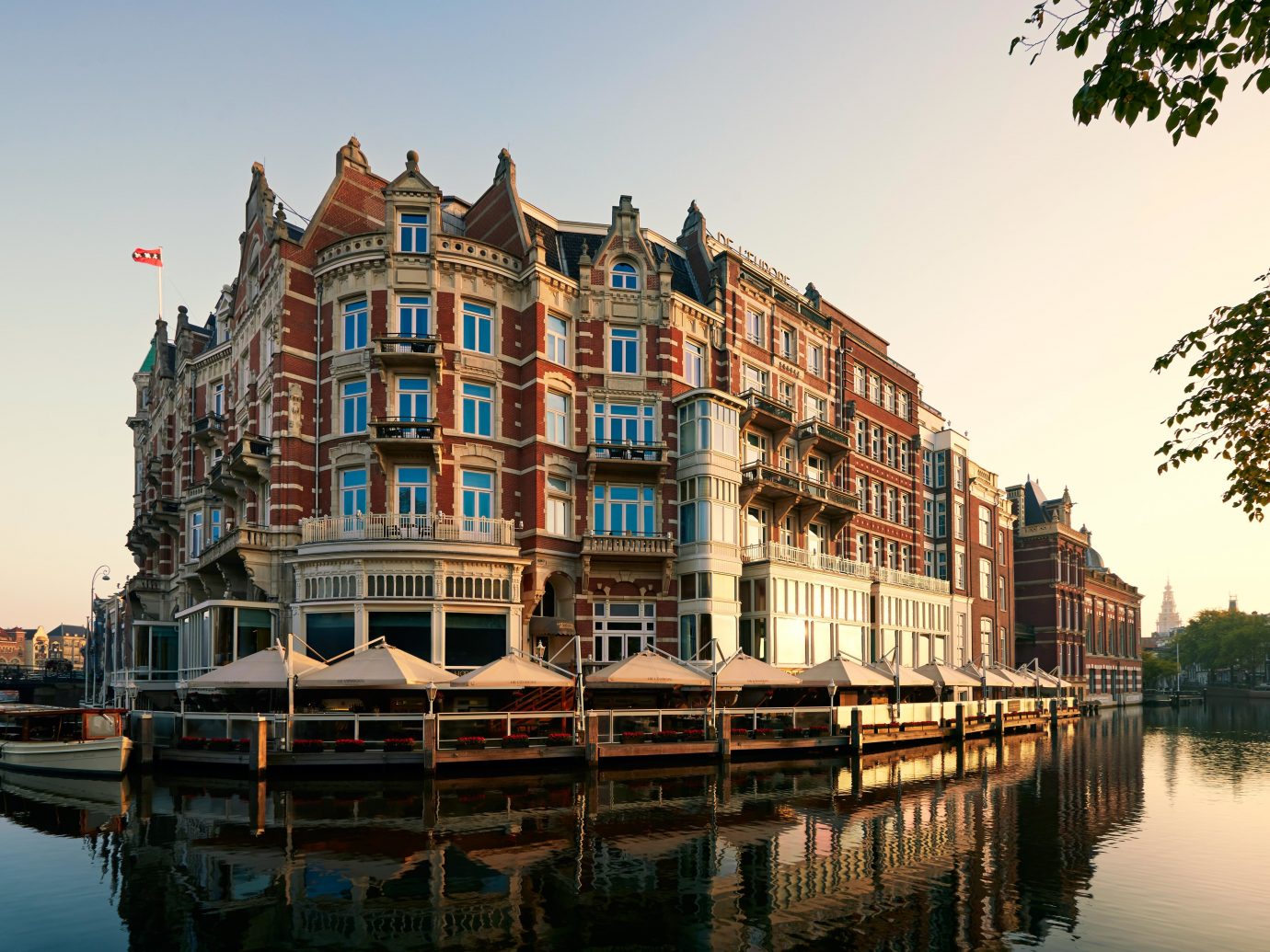 Amsterdam Architecture Buildings City Elegant Historic Hotels Lake The Netherlands Waterfront water outdoor sky Boat scene landmark reflection waterway River vehicle Harbor Canal tourism cityscape