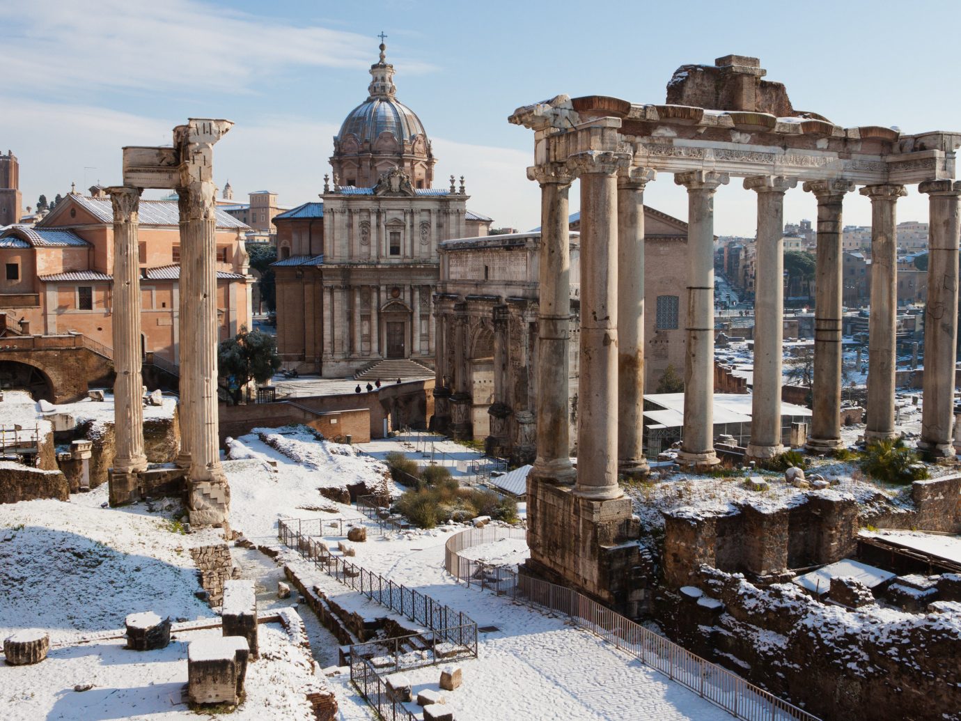 Boutique Hotels Romance Trip Ideas outdoor snow building ancient history Ruins ancient rome ancient roman architecture history historic site archaeological site Winter City tourist attraction sky plaza column facade ruin day colonnade