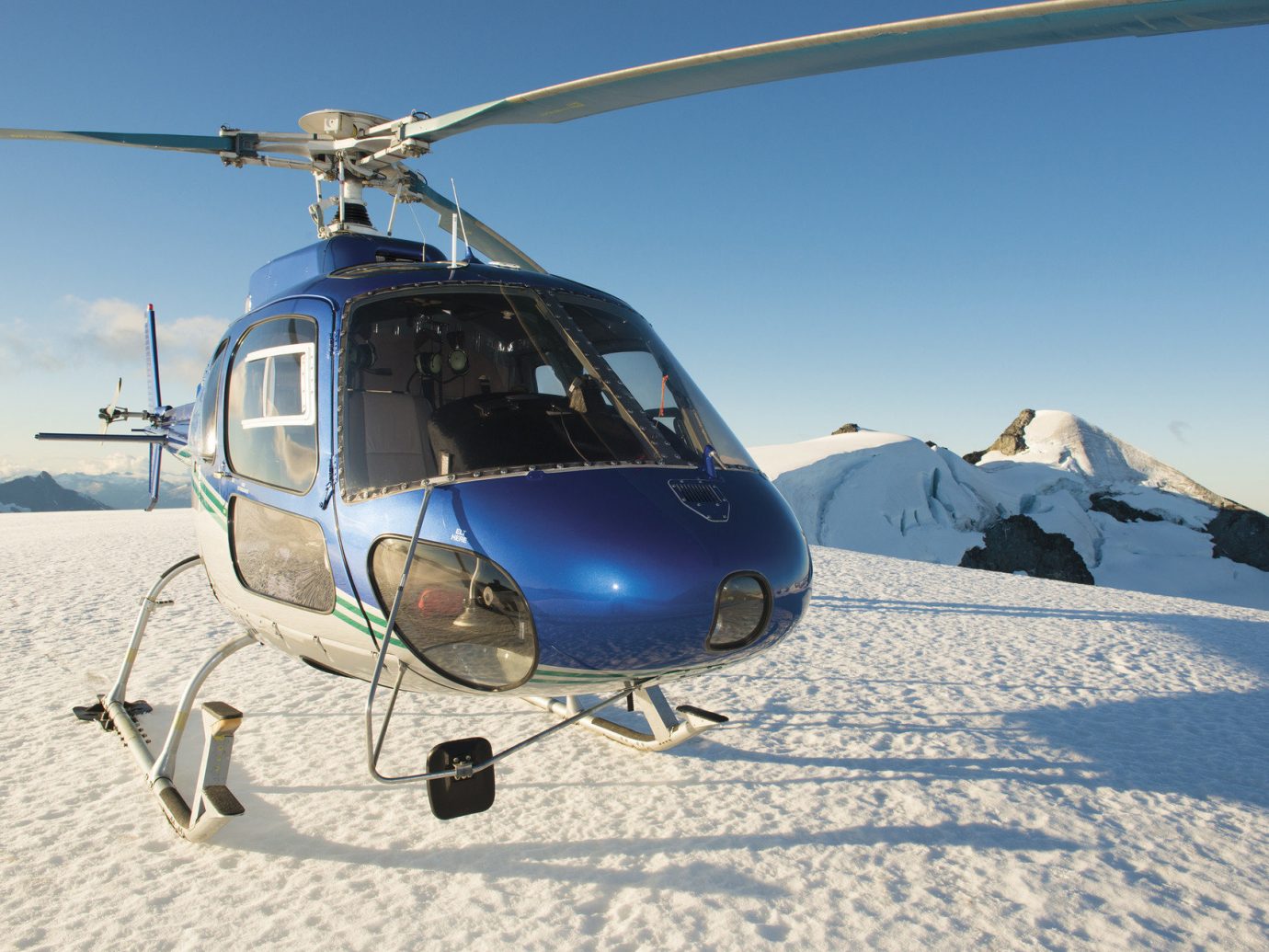 helicopter Hotels isolation Luxury Travel Mountains remote snow transportation Winter sky outdoor vehicle helicopter rotor rotorcraft aircraft transport atmosphere of earth aviation military helicopter flight autogiro