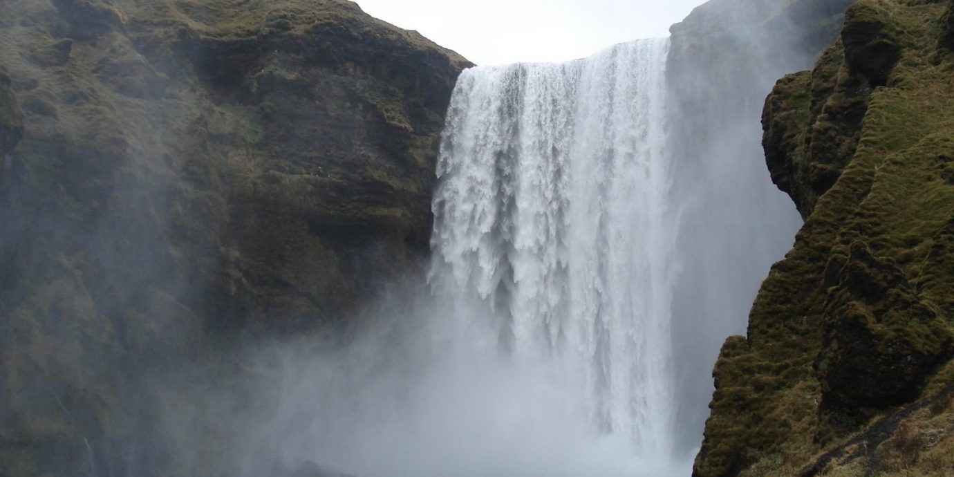 Iceland Outdoors + Adventure mountain Nature outdoor Waterfall rock body of water atmospheric phenomenon water water feature Coast cliff Sea wasserfall terrain fjord