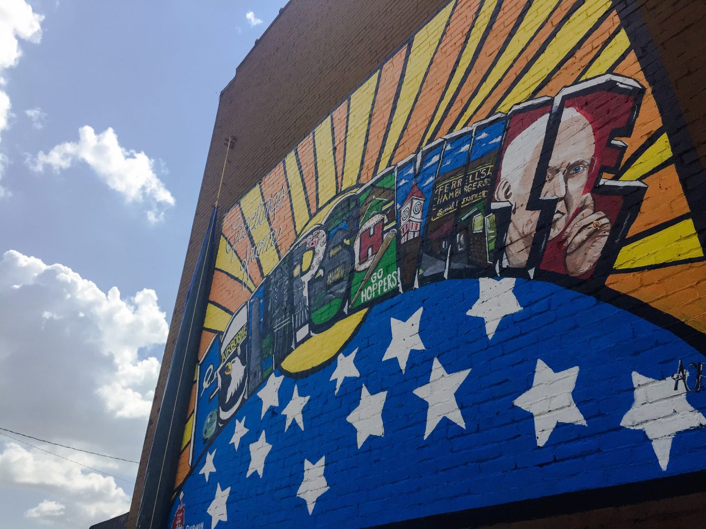 Offbeat sky blue outdoor flag wall mural daytime street art graffiti painted