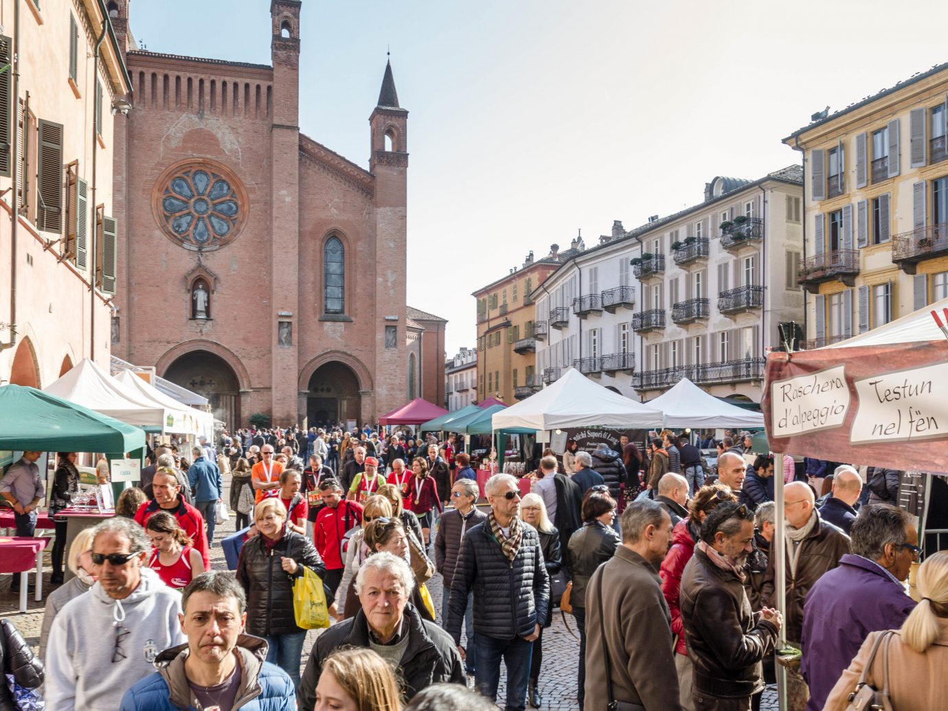 Food + Drink Hotels Italy Luxury Travel Trip Ideas building person outdoor people marketplace market City public space street Town crowd bazaar stall tourism group flea market fair fête town square Downtown pedestrian