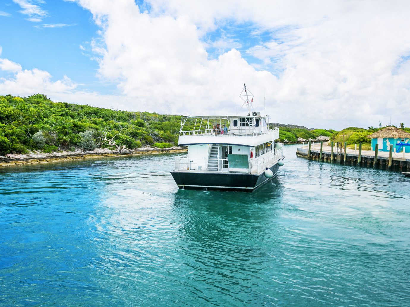 Beach Trip Ideas water sky outdoor Boat landform Sea geographical feature vehicle vacation Ocean shore ferry bay channel Coast caribbean passenger ship waterway Island ship traveling day