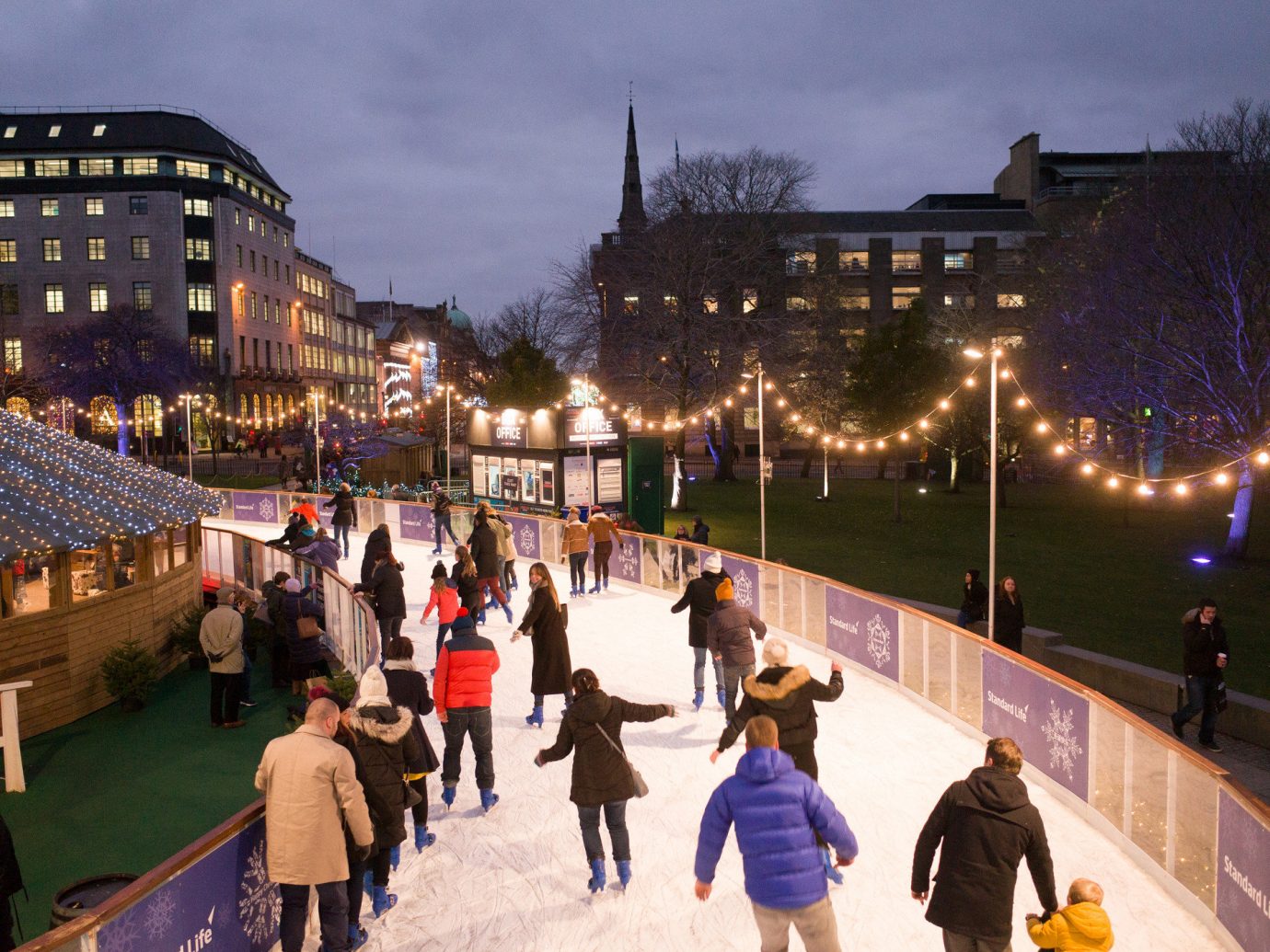 Trip Ideas outdoor person crowd City night rink ice rink town square evening tourism plaza cityscape line