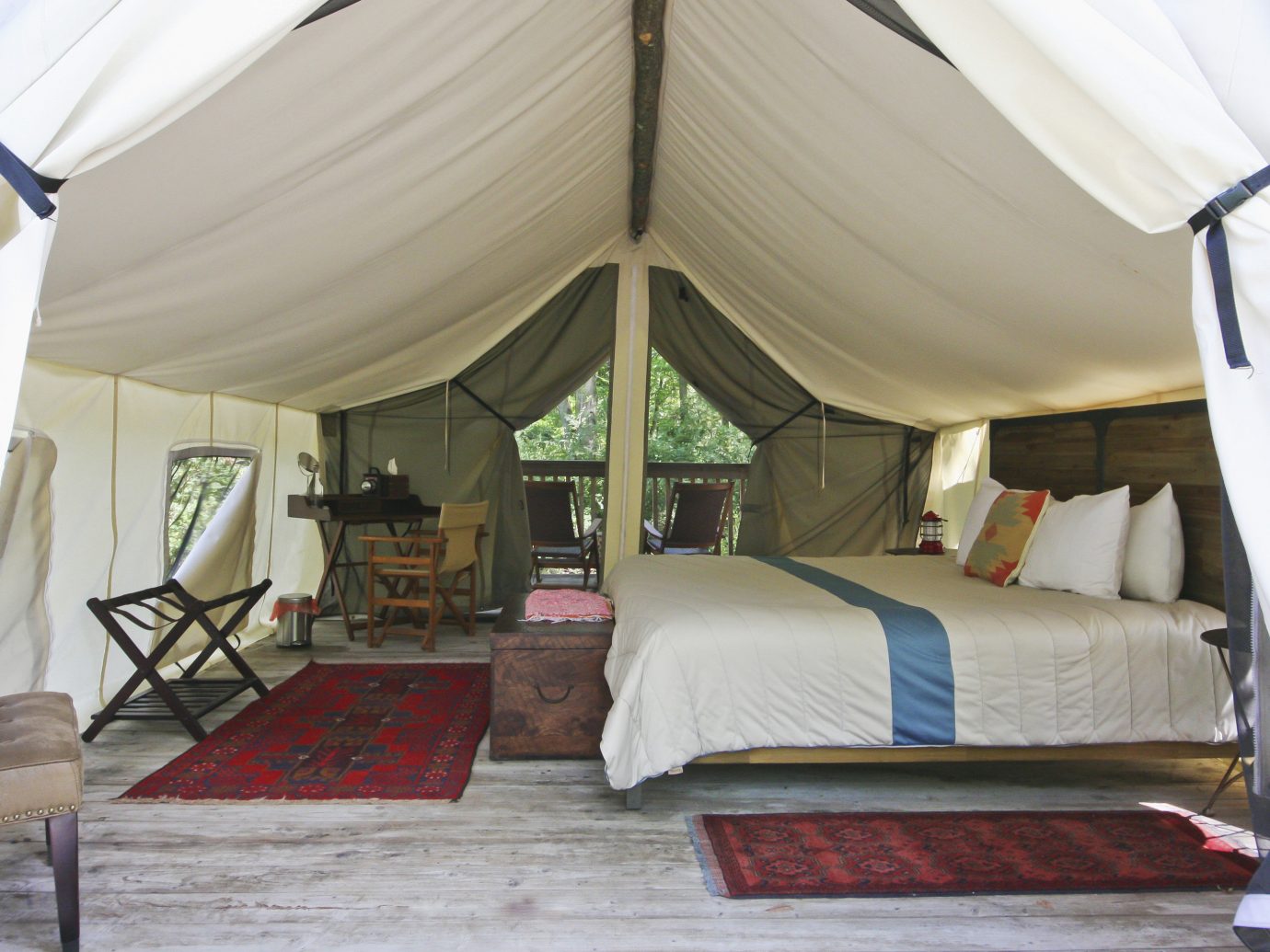 Glamping Outdoors + Adventure Weekend Getaways indoor floor tent room Bedroom camp estate outdoor object furniture