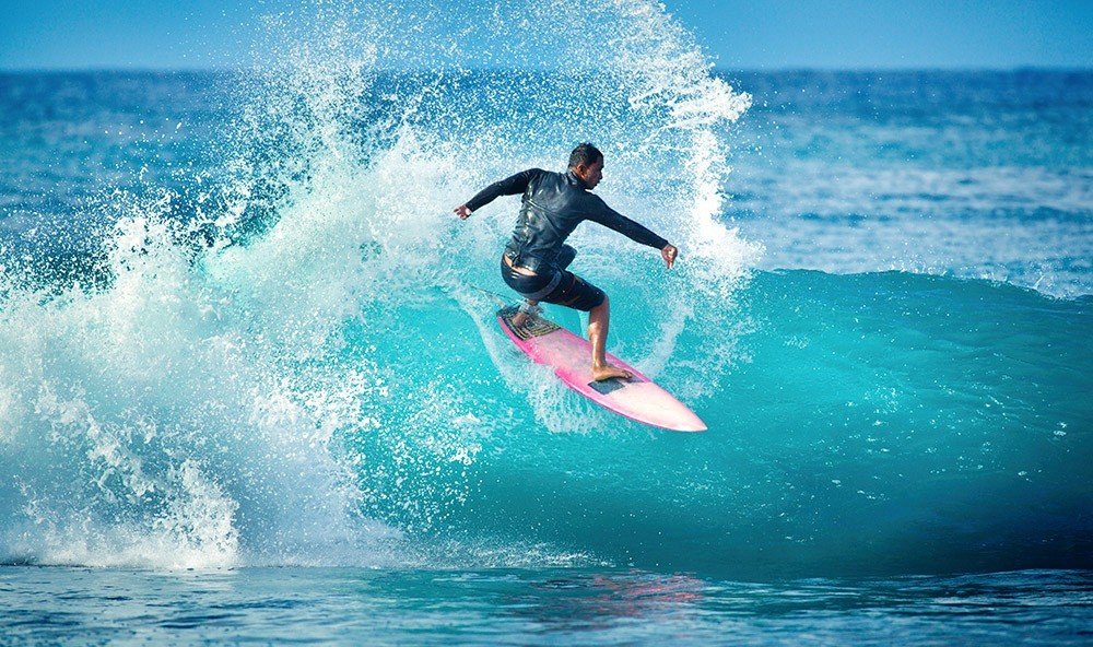Health + Wellness Trip Ideas water wave surfing outdoor riding water sport Sport man Ocean sports wakesurfing wind wave surfboard boardsport surfing equipment and supplies surface water sports rider Sea extreme sport individual sports male
