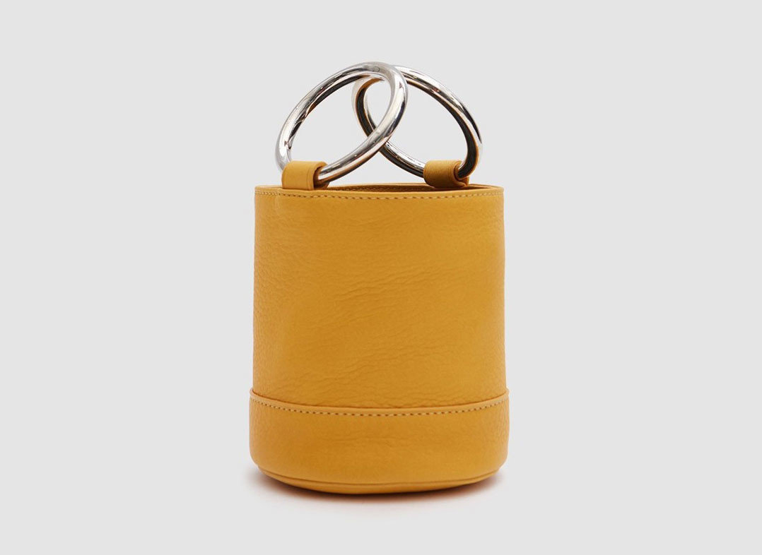 Travel Shop Travel Trends yellow fashion accessory product bag leather handbag product design brand coin purse accessory