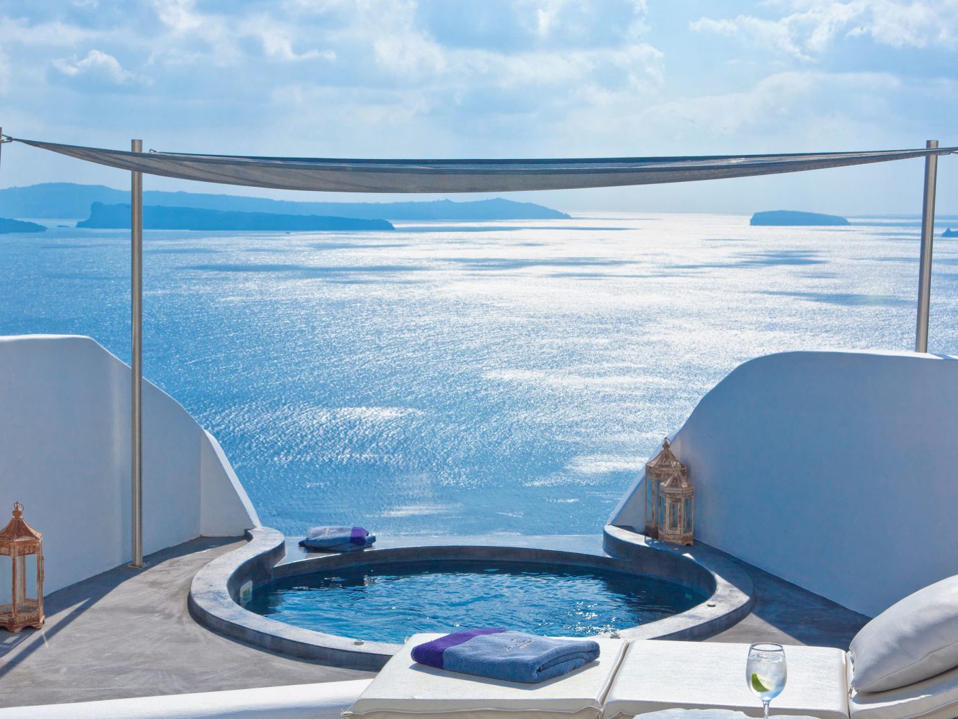 Balcony Classic Elegant Greece Hot tub/Jacuzzi Hotels Island Luxury Romantic Santorini Scenic views Suite Trip Ideas Waterfront sky water outdoor swimming pool yacht Boat vehicle vacation Ocean overlooking passenger ship Sea bed jacuzzi Deck day