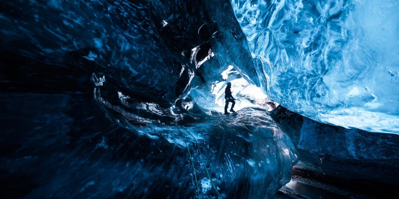 Offbeat Trip Ideas ice cave blue landform geographical feature cave ice extreme sport glacial landform screenshot formation sea cave