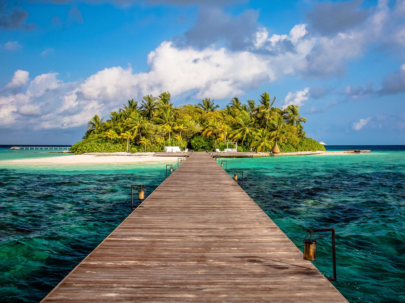 wooden bridge to an island at Coco Privé, Maldives