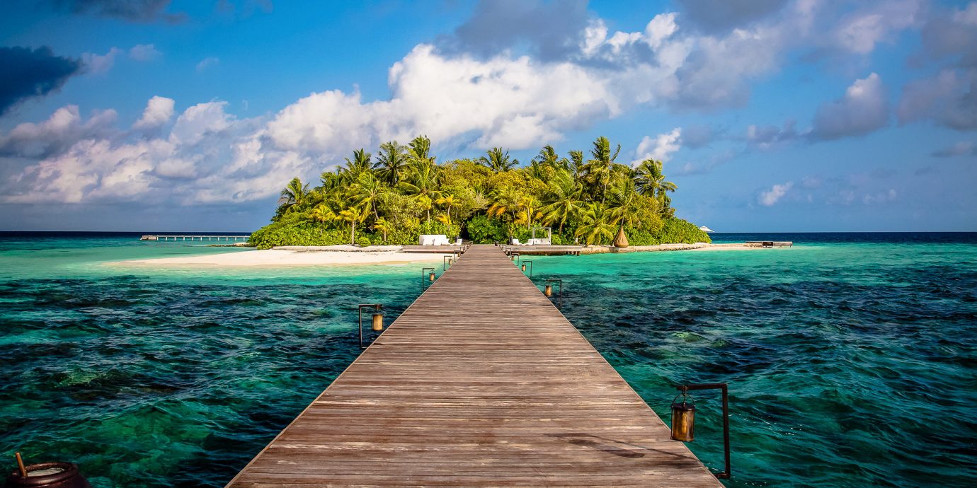 wooden bridge to an island at Coco Privé, Maldives