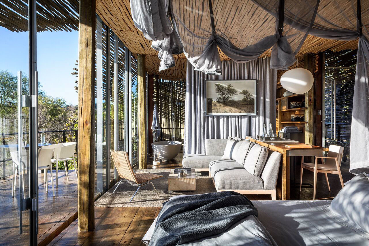 Luxury Travel Outdoors + Adventure Safaris Trip Ideas indoor property room house home bed estate porch living room interior design real estate cottage wood Resort outdoor structure mansion Bedroom furniture