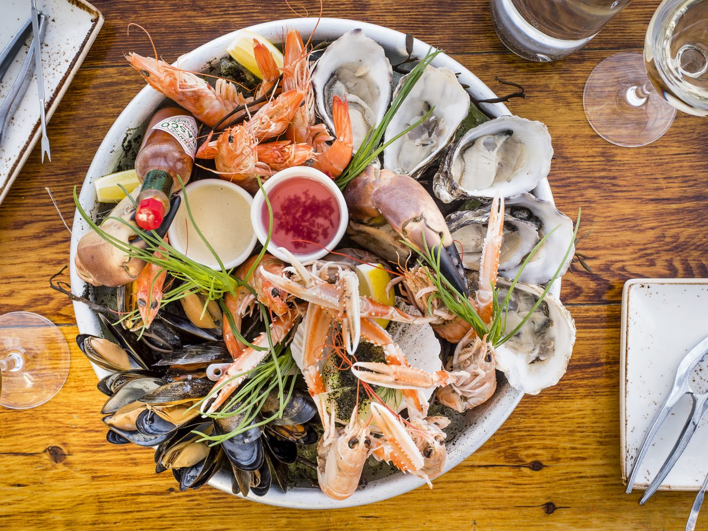 Trip Ideas table plate food dish meal cuisine fish Seafood produce mussel dinner variety