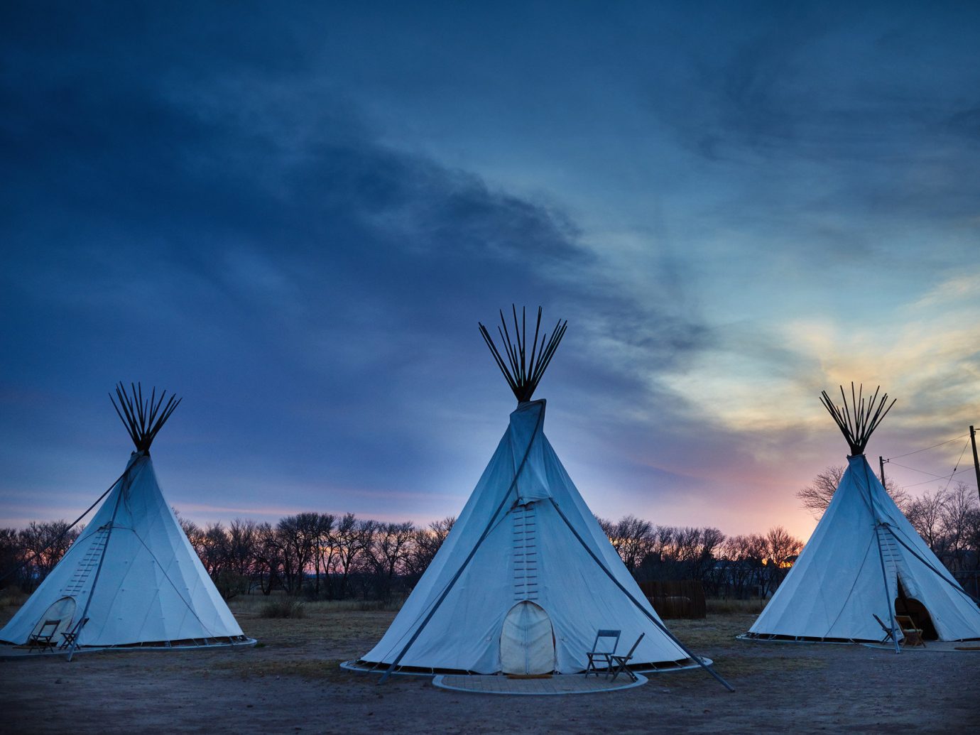 artistic artsy calm dawn dusk Exterior Glamping Hip Hotels isolation Luxury Travel Outdoors + Adventure quirky remote serene Solo Travel teepee trendy Trip Ideas Weekend Getaways tepee sky outdoor building water blue cloud light Sea horizon Winter night evening morning Ocean sunlight ice reflection Sunset lit wind several