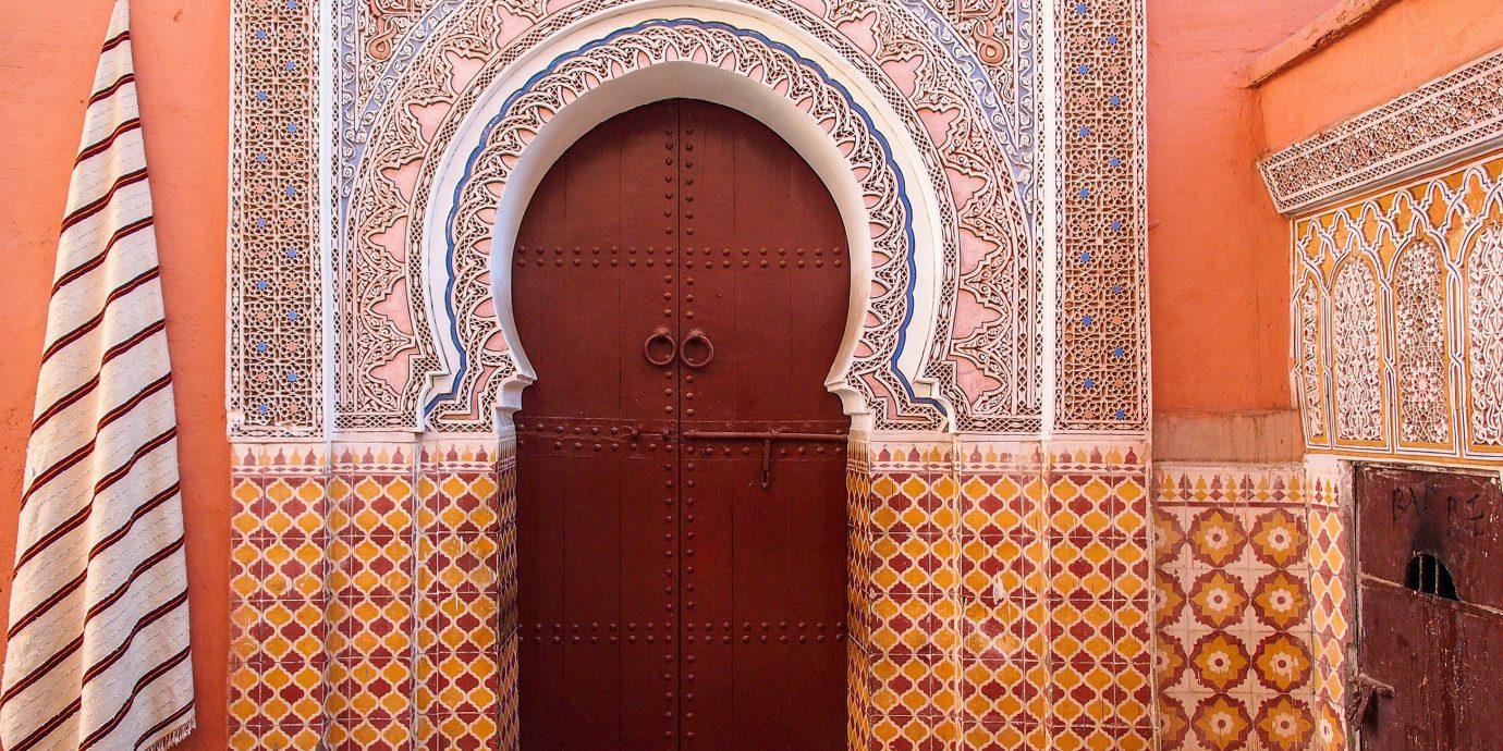 Arts + Culture Marrakech Morocco Style + Design arch wall Architecture brick brickwork door facade window building