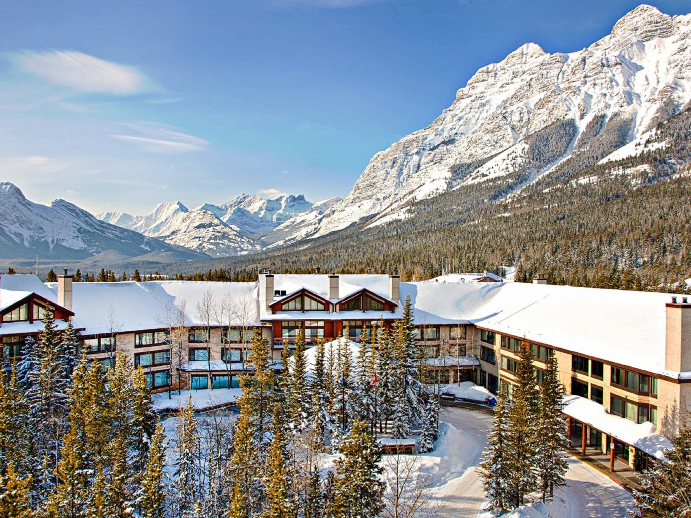 Alberta Boutique Hotels Canada Hotels Road Trips Winter mountain range mountainous landforms mountain snow sky alps tourist attraction real estate glacial landform reflection mount scenery tourism elevation tree vacation Lake roof landscape