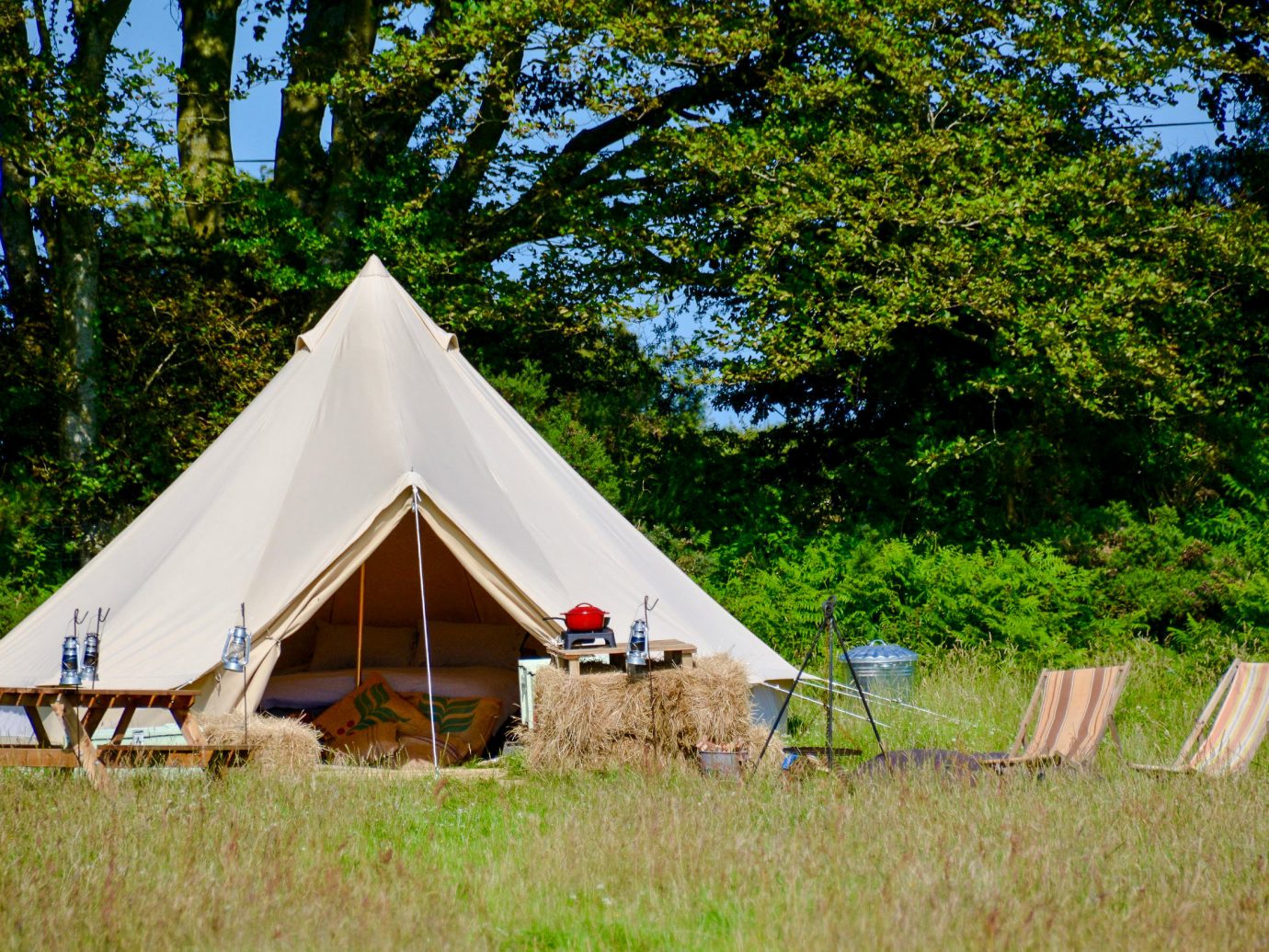 Glamping Outdoors + Adventure Trip Ideas tree grass outdoor tent outdoor object camping hut cottage yurt national park sky landscape recreation lush