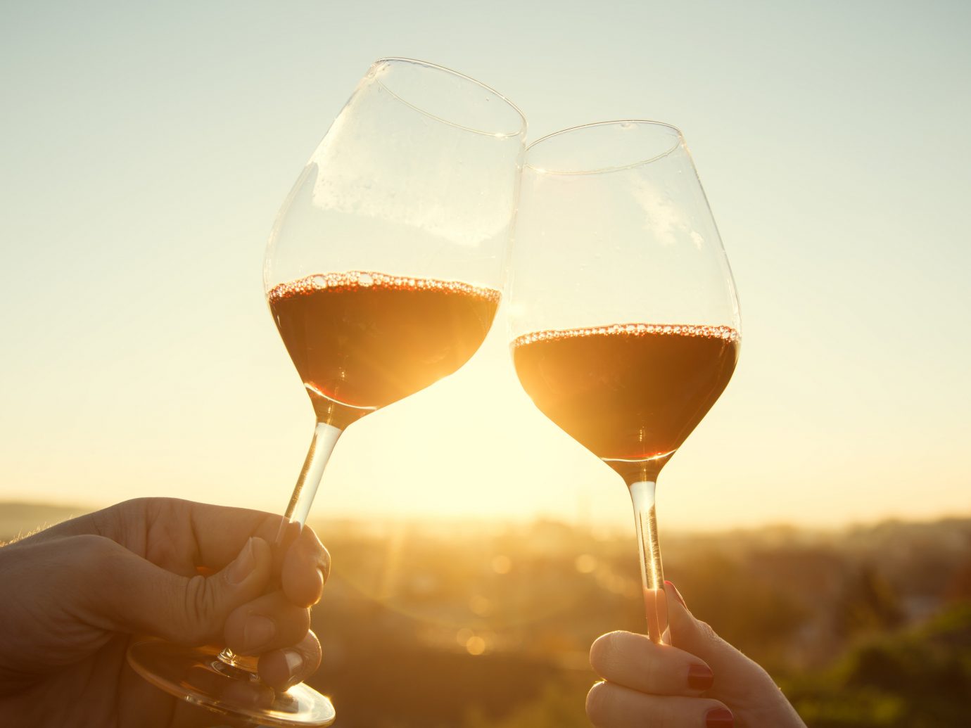 Food + Drink Girls Getaways Travel Tips Trip Ideas Weekend Getaways wine sky person alcoholic beverage Drink wine glass stemware glass alcohol red wine close up morning reflection distilled beverage liqueur sense food container drinkware champagne white wine beverage