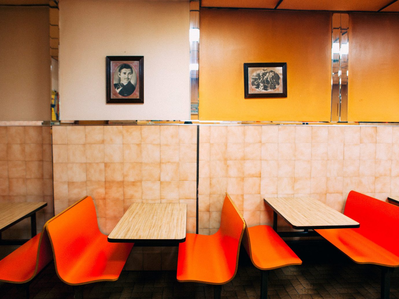 Food + Drink indoor wall floor color red orange room yellow interior design art Design restaurant furniture colored