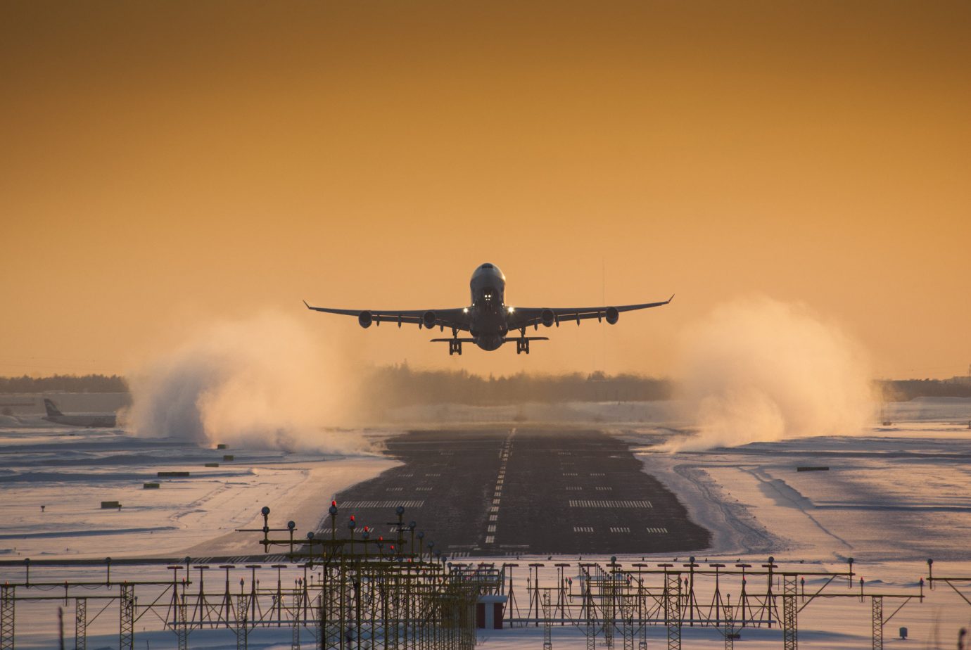 aerial airplane airport flying landing road snow Sunset transportation Travel Tips Winter outdoor sky plane smoke atmospheric phenomenon airline coming aviation aircraft atmosphere of earth airliner vehicle morning flight air force sunrise takeoff wing runway engine
