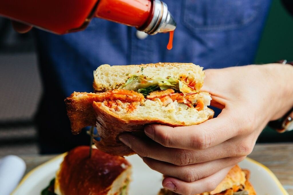 Eat food Food + Drink hand people pouring sandwich Trip Ideas person dish meal cuisine breakfast produce sense restaurant fast food lunch snack food