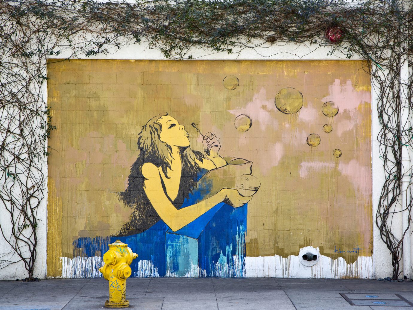 Trip Ideas tree outdoor color yellow hydrant mural wall urban area art graffiti street art road street painting painted