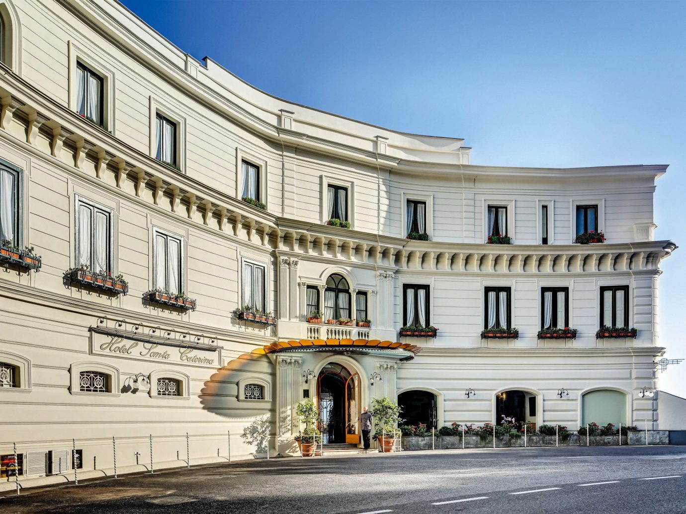 Hotels Romance sky outdoor building classical architecture landmark Architecture palace facade window plaza white real estate estate château town square tourism apartment mansion City government building